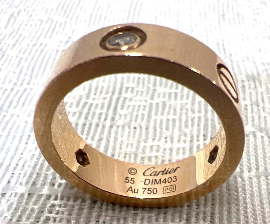 An 18 Karat Gold And Diamond Love Ring Cartier