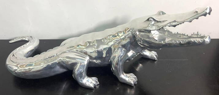 CROCODILE Aluminum sculpture signed Richard Orlinski (Born1966) Born Wild: RICHARD ORLINSKI (1966) Born Wild CROCODILE Aluminum sculpture signed and numbered N 8 / 8 on a metal plate DIMENSIONS :Height: 11.50 inch / 29 cm Length: 29 inch / 75 cm