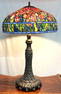 Large Tiffany style Table Lamp with an Arch and Leaf style bronze base