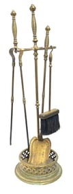 Group of brass hearth tools, comprising one shovel, one tong, brush, and stand.