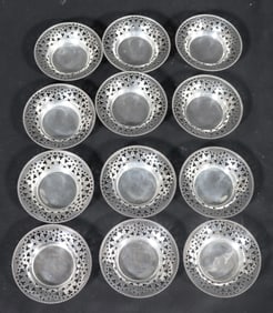 Twelve Sterling Silver Coasters