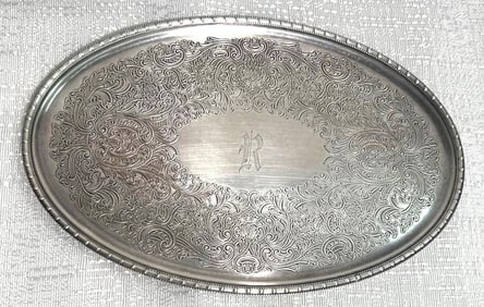 Old silver-plated tray made by the Ellis-Barker silver company in England.