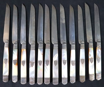 12 French Sterling Silver knives with mother-of-pearl handled knives.