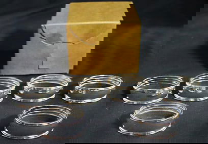 Six Silver plated napkin rings.