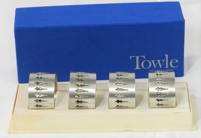 Four pewter napkin rings with box