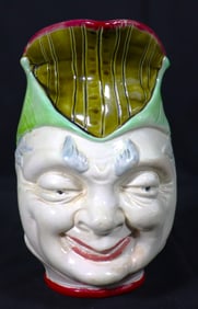 Puck majolica character jug by Wardle, England