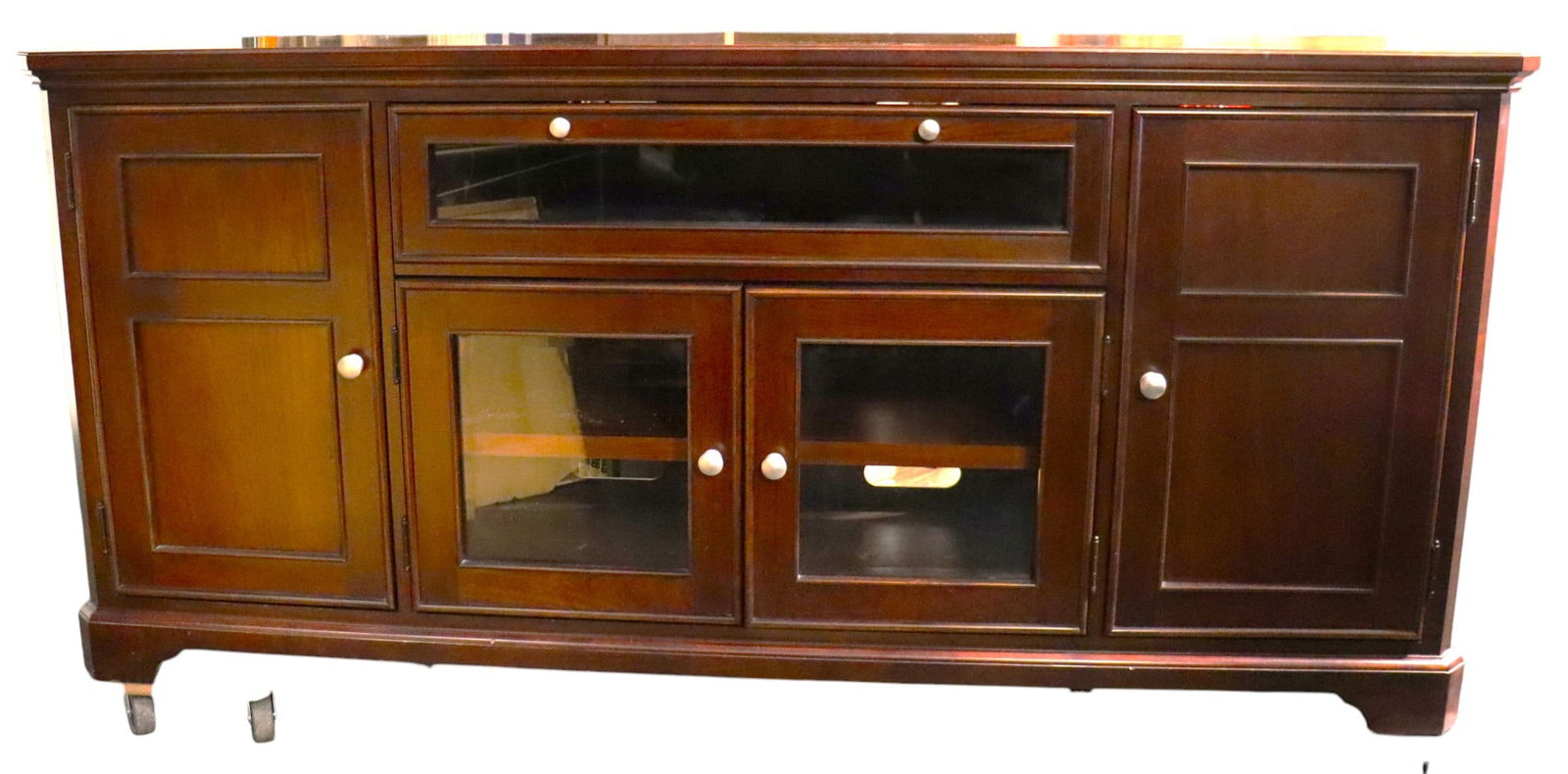 The TV Stand, console: The TV Stand, console is beautifully crafted for flat screen TVs and other media storage. Two shelves behind the cabinet doors are adjustable, as well as the middle shelf, to accommodate varying sizes