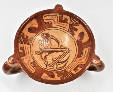 Pre-Columbian Pottery Tripod Bowl, Costa Rica.: Pre-Columbian Pottery Tripod Bowl, Costa Rica. Circa 1350. Cream colored bowl with orange and brown paint, the legs represent stylized animal heads, and the rest of the decoration are related to