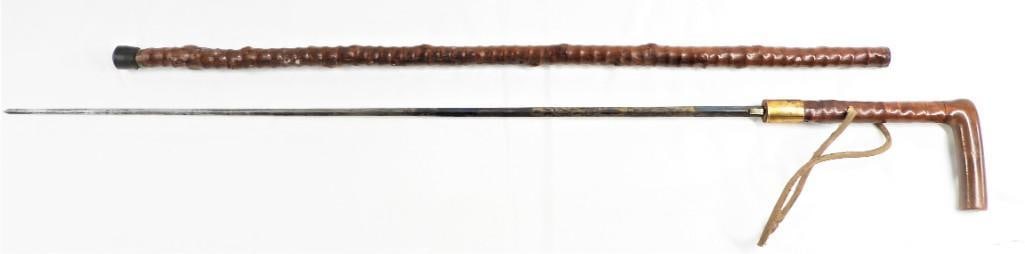 WOODEN SWORD CANE: WOODEN SWORD CANE DIMENSIONS TOTAL: Length 33 inch / 83,7cmDIMENSIONS BLADE: Length 25.50 inch / 64,5 cm Shipping: Basel Auction House will refer local third-party USA and international shippers. Purc