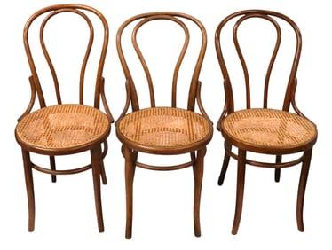 Three bentwood chairs, likely Thonet chairs or similar models produced by Mundus