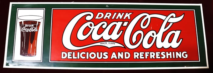 Vintage metal tin Coca Cola Delicious and Refreshing sign green, red, and white with picture of