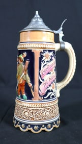Vintage classic German beer stein, likely crafted from ceramic with a relief decoration and a pewter