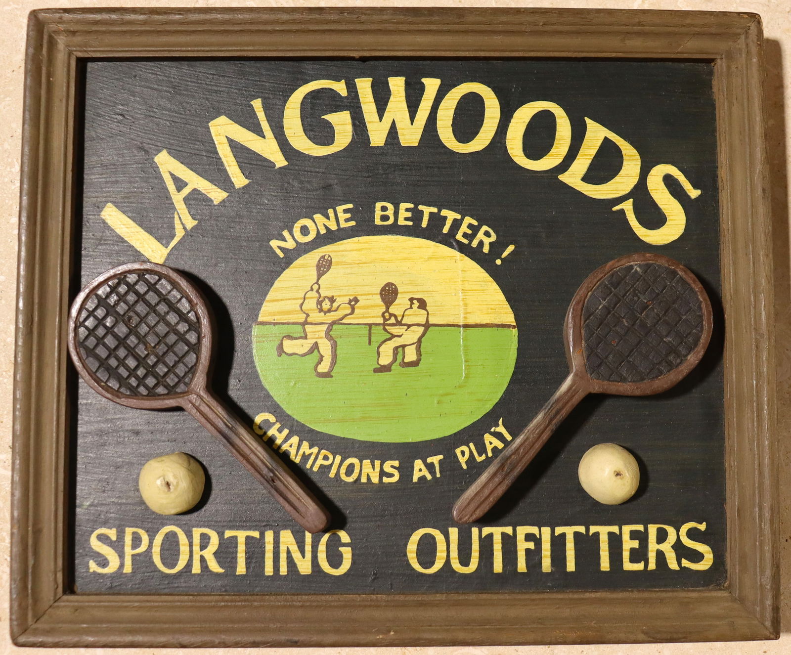 Framed Vintage Wooden sign of Langwoods Sporting Outfitters: Framed Vintage Wooden sign of Langwoods Sporting Outfitters Langwoods Sporting Outfitters is a name associated with vint