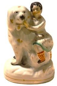 English Staffordshire pottery figurine, depicting a child with a large dog.