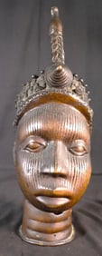 The sculpture is a bronze head from Ife, Nigeria,