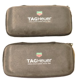 Two TAG Heuer hard shell travel cases.