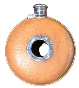 Vintage Leather Clad Flask Beautifully constructed of leather clad metal with screw off cap.