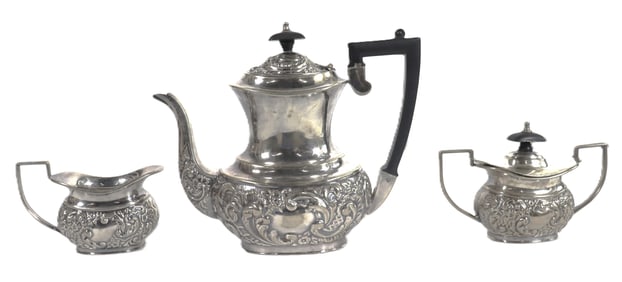 An ornate silver-plated tea set made in England