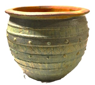 A green-glazed terracotta planter