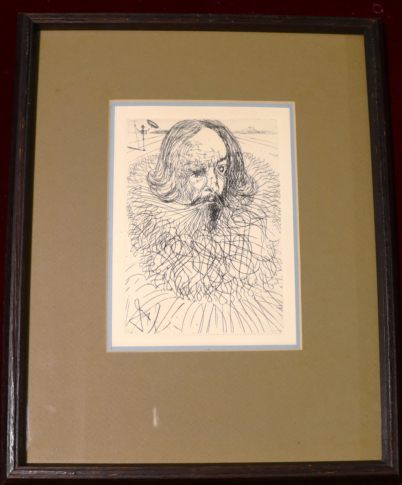 Framed etching by Salvador Dali is a portrait of Miguel de Cervantes Saavedra: Framed etching by Salvador Dali is a portrait of Miguel de Cervantes Saavedra, an influential Spanish writer from the 16th century. This piece, part of Dali's series titled "Spanish Immo