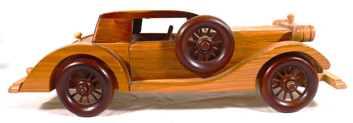 Vintage-inspired, handcrafted wooden model of a classic car, likely a 1932 Ford V8 or a similar