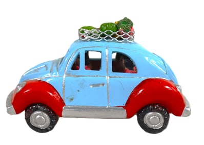 Vintage-style blue car, a classic Volkswagen Beetle, featuring a rack on top filled with fruits or