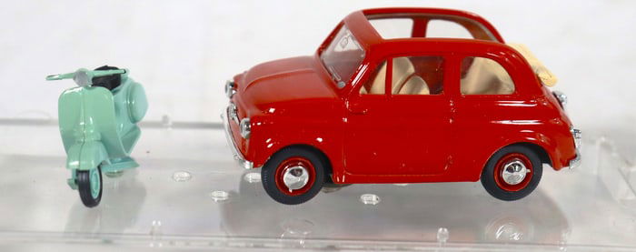 Vintage 1:43 scale diecast model set featuring a red Fiat 500 and a light green Vespa scooter.