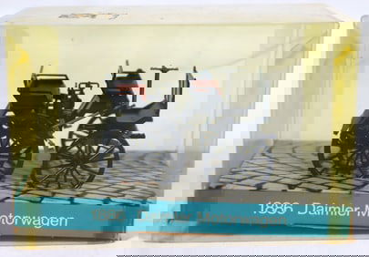 Vintage diecast model of the 1886 Daimler Motorkutsche (also known as the Daimler Motorwagen).