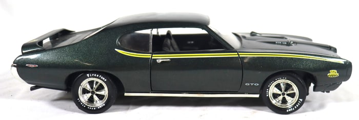Vintage ERTL 1:18 scale diecast model of a 1969 Pontiac GTO Judge.