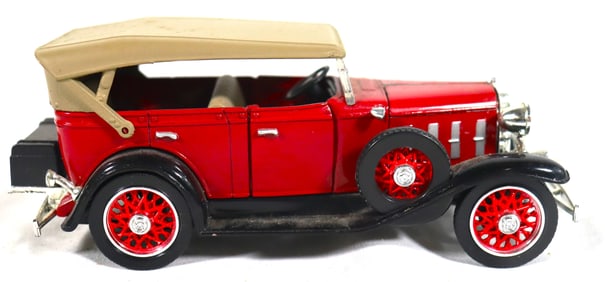 Vintage Red 1932 Chevrolet Phaeton die-cast model, likely a 1:32 scale