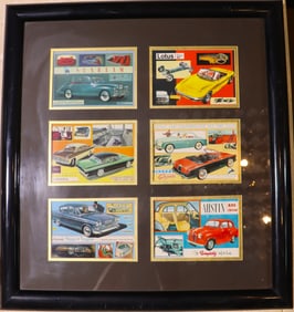 Framed vintage cards featuring classic British cars from the 1950s and 1960s.