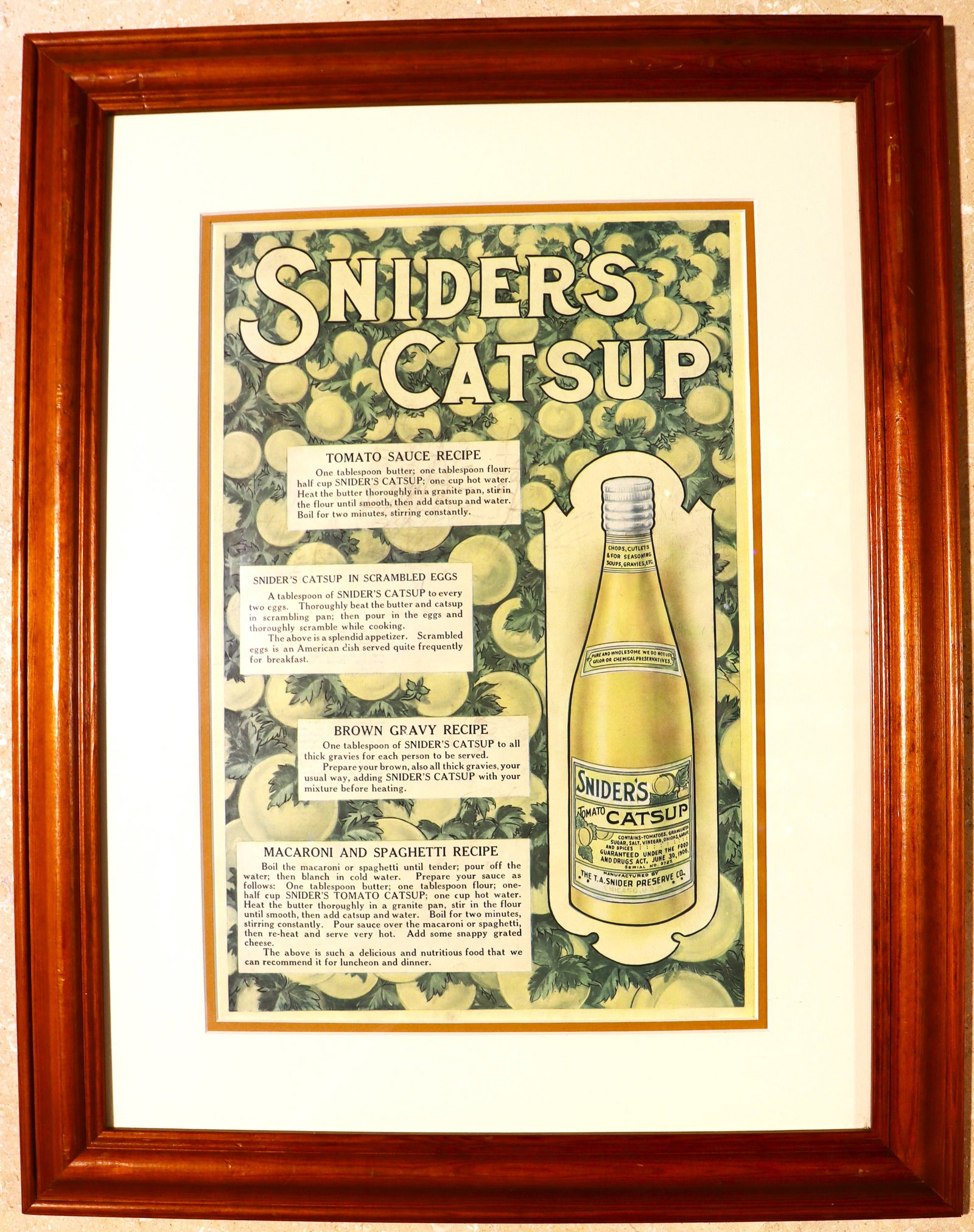 Framed vintage advertisement for Snider's Catsup, which was a product of the T.A. Snider Preserve: Framed vintage advertisement for Snider's Catsup, which was a product of the T.A. Snider Preserve Company, founded in 1879. The ad, likely from around 1916, includes recipes for usi