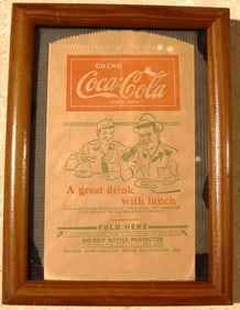 Framed vintage Coca-Cola No-Drip Bottle Protector or "dry server,"