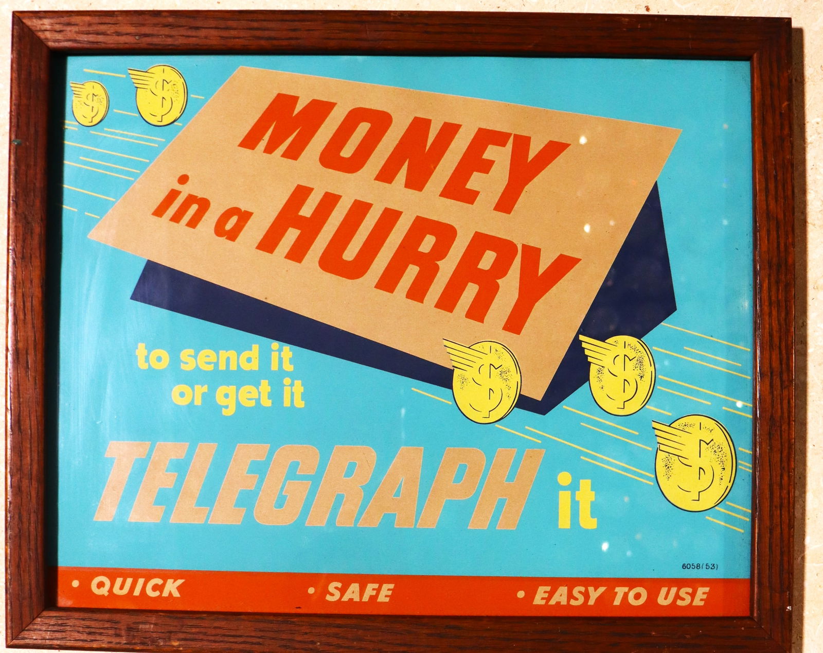Framed Vintage Advertising promoting the use of a telegraph service to send or receive money: Framed Vintage Advertising promoting the use of a telegraph service to send or receive money quickly.This is a vintage advertisement promoting the use of a telegraph service to send or receive money