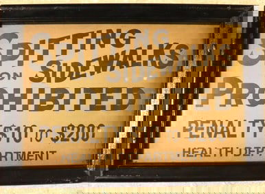 Framed Vintage sign that prohibits spitting on sidewalks.