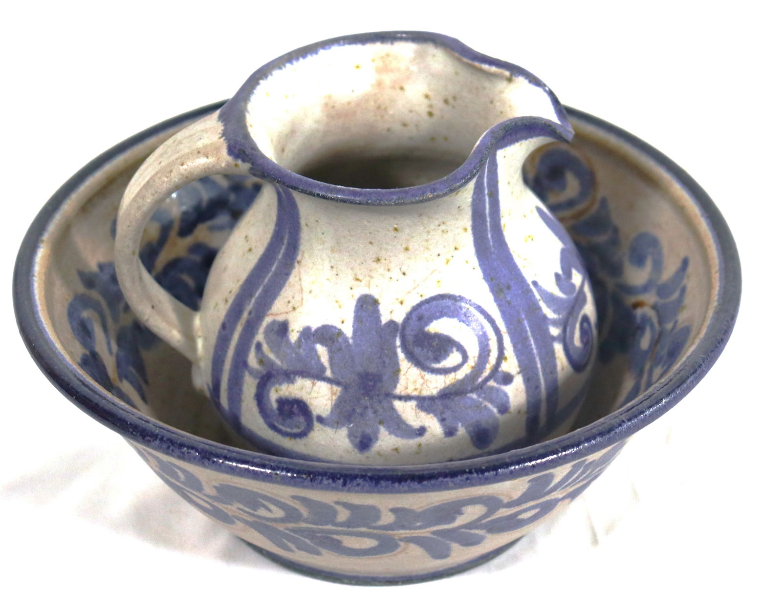 Set of salt-glazed stoneware pottery, pitcher and a matching bowl, featuring a cobalt blue floral or: This is a set of salt-glazed stoneware pottery, pitcher and a matching bowl, featuring a cobalt blue floral or scroll design by Art Studio BERKSHIN POTTERY DIMENSIONS Bowl: Height 3.50 inch