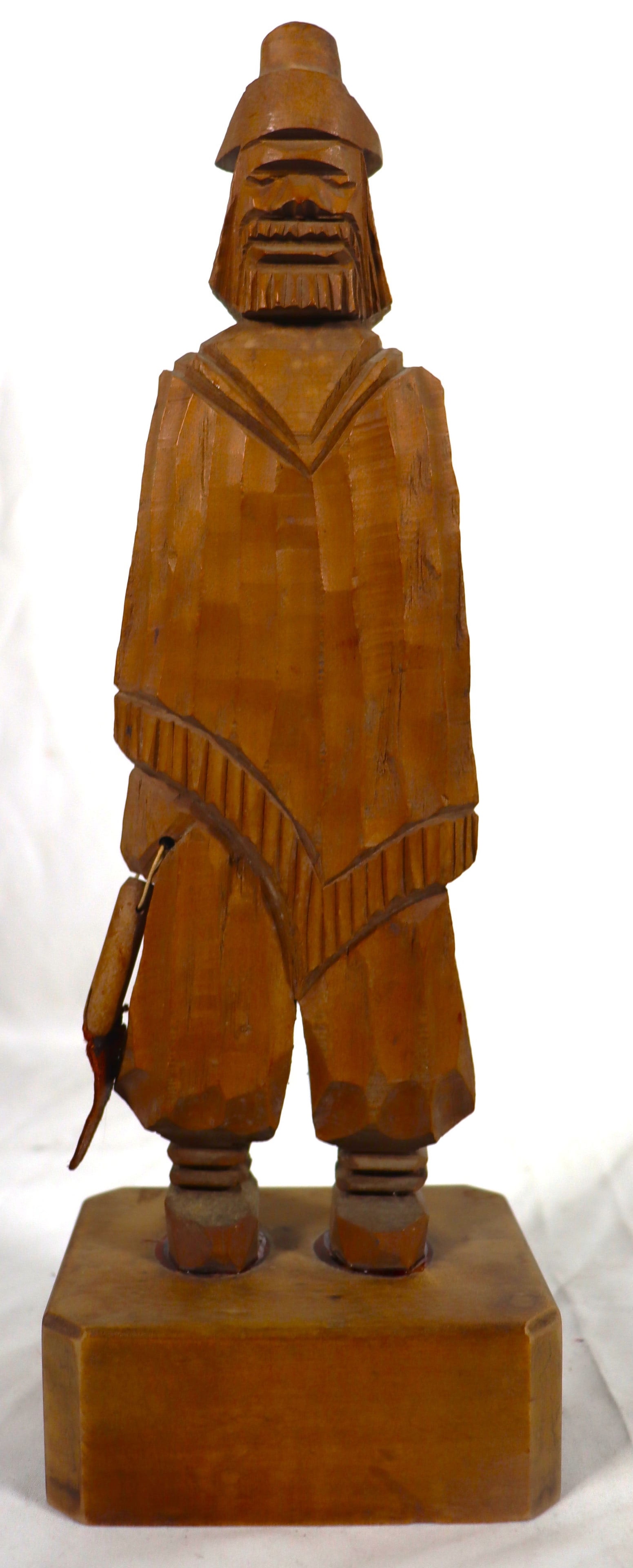 Vintage hand-carved wooden gaucho figurine,: Vintage hand-carved wooden gaucho figurine, often marked "Industria Argentina it depicts a gaucho, the fabled cowboy of Argentina. The figure is carved from wood and features a hat