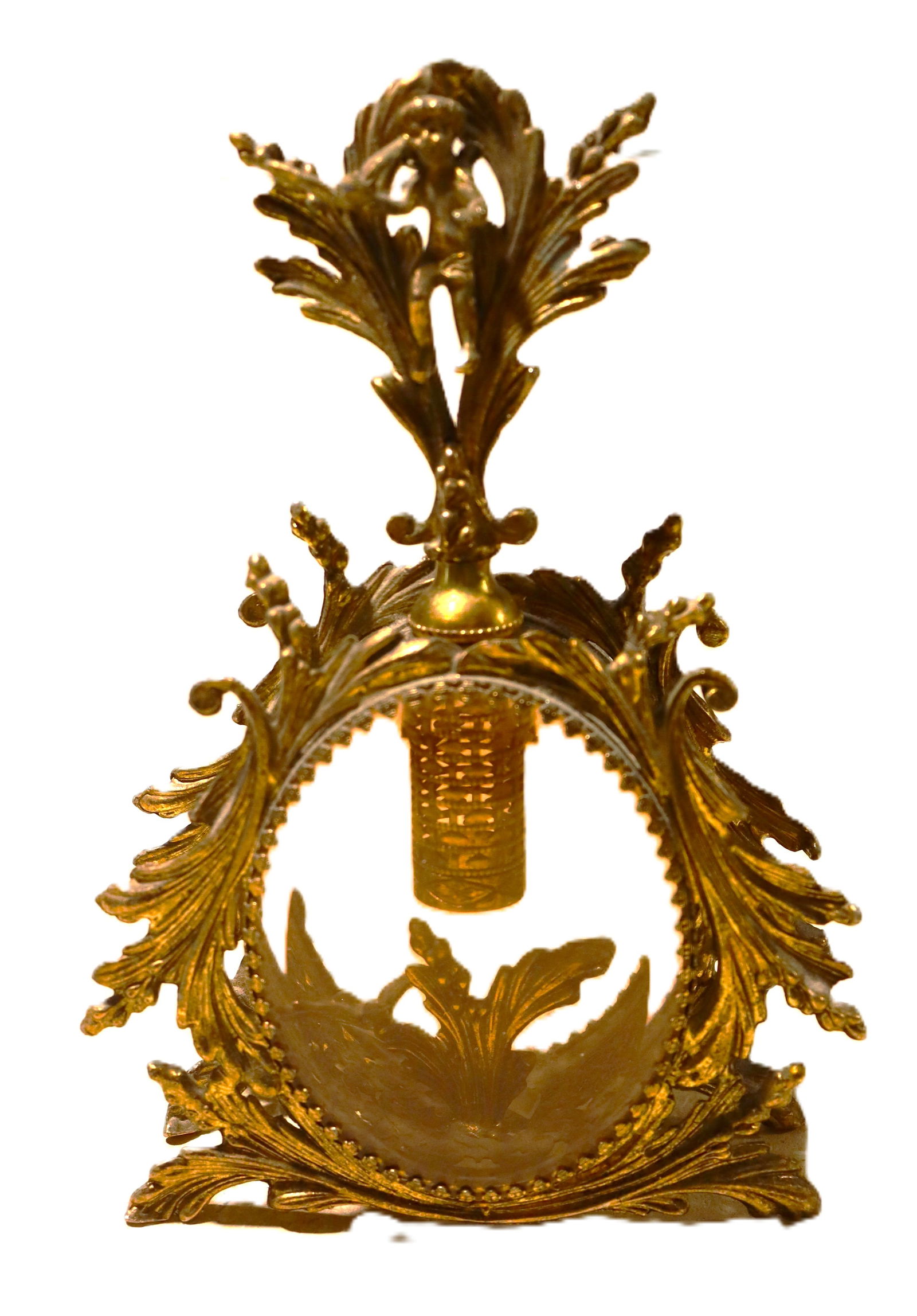 Vintage Ormulu Gilt Filigree Pink Glass Perfume Bottle: This is a vintage ormolu perfume bottle. Ormolu is a gold-colored alloy used for decorative objects. These bottles often feature intricate filigree and decorative elements such as cherubs, d