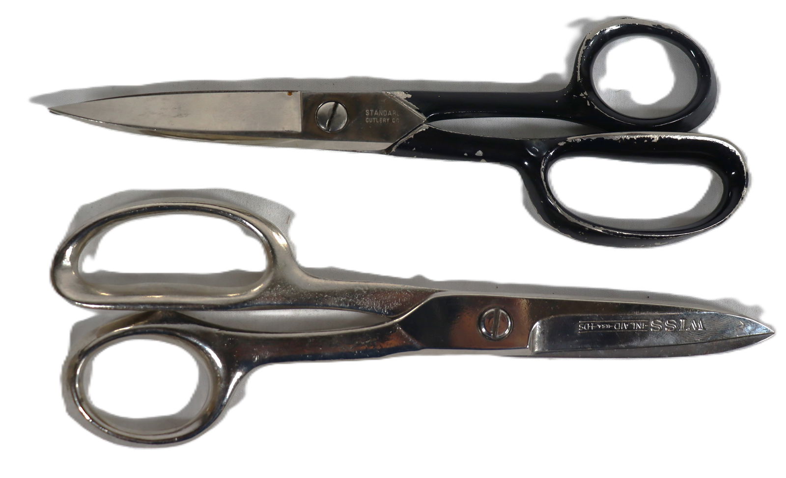 Two industrial Scissors: Two industrial Scissors, with the top one likely being the Wiss W20 model. DIMENSIONS black: Height: 8.25 inch / 21 cm 