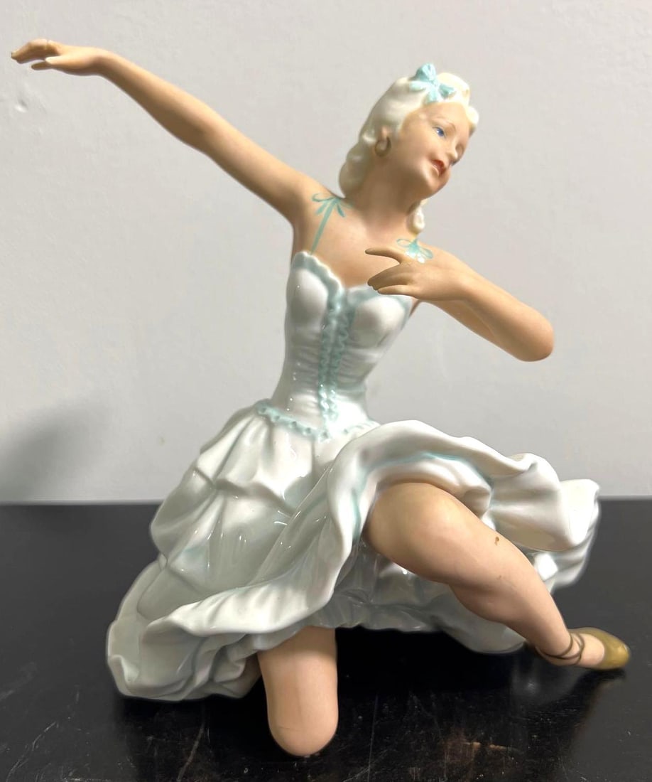 A 20thC German porcelain seated ballerina. (1 of 8)
