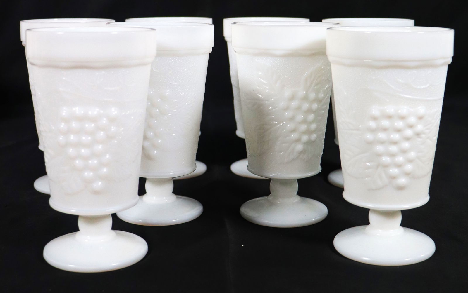 Set of Eight vintage white milk glass goblets featuring an embossed grape and leaf pattern. (1 of 10)