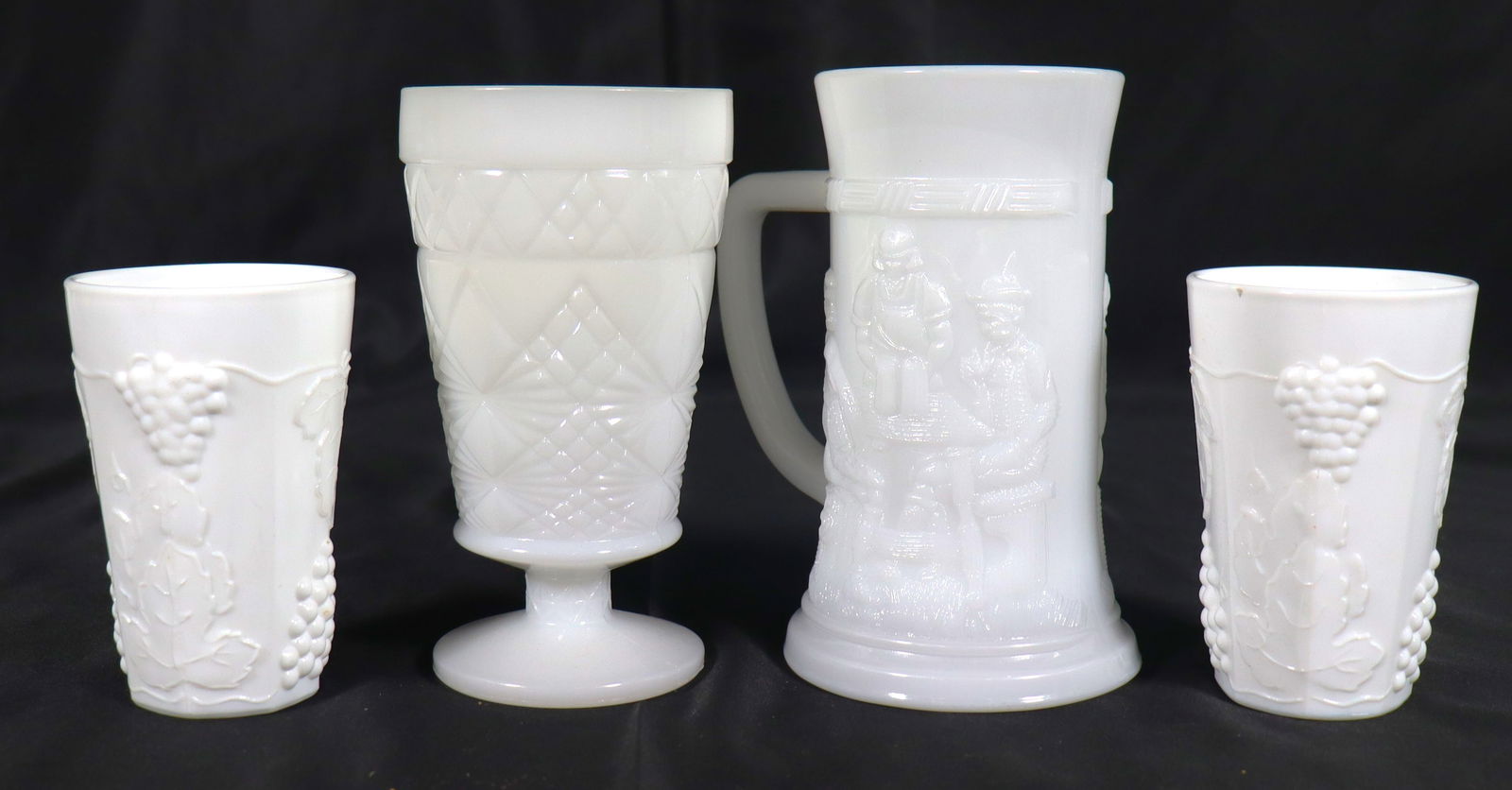 Four vintage white milk glass items are collectible beer steins and drinkware, (1 of 5)