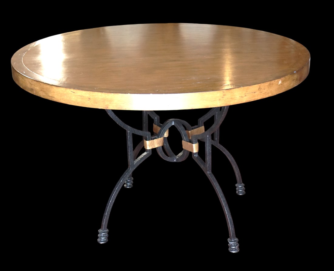 Round dining table with a black wrought iron base and wooden, top. (1 of 9)