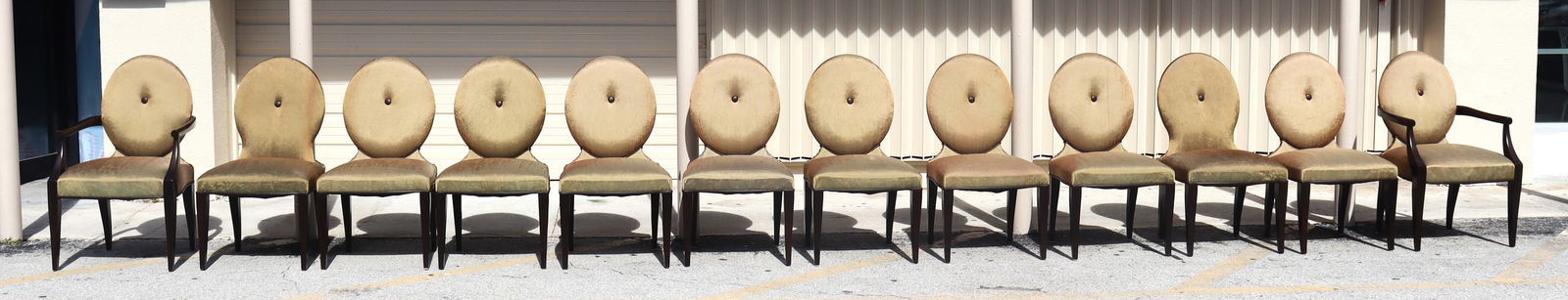 Set of Ten dining chairs in the style of Donghia and two armchairs: Set of Ten dining chairs in the style of Donghia and two armchairs, covered in vintage upholstery. Fabric is in good condition with some minor stains. DIMENSIONS Chairs (10): Height: 