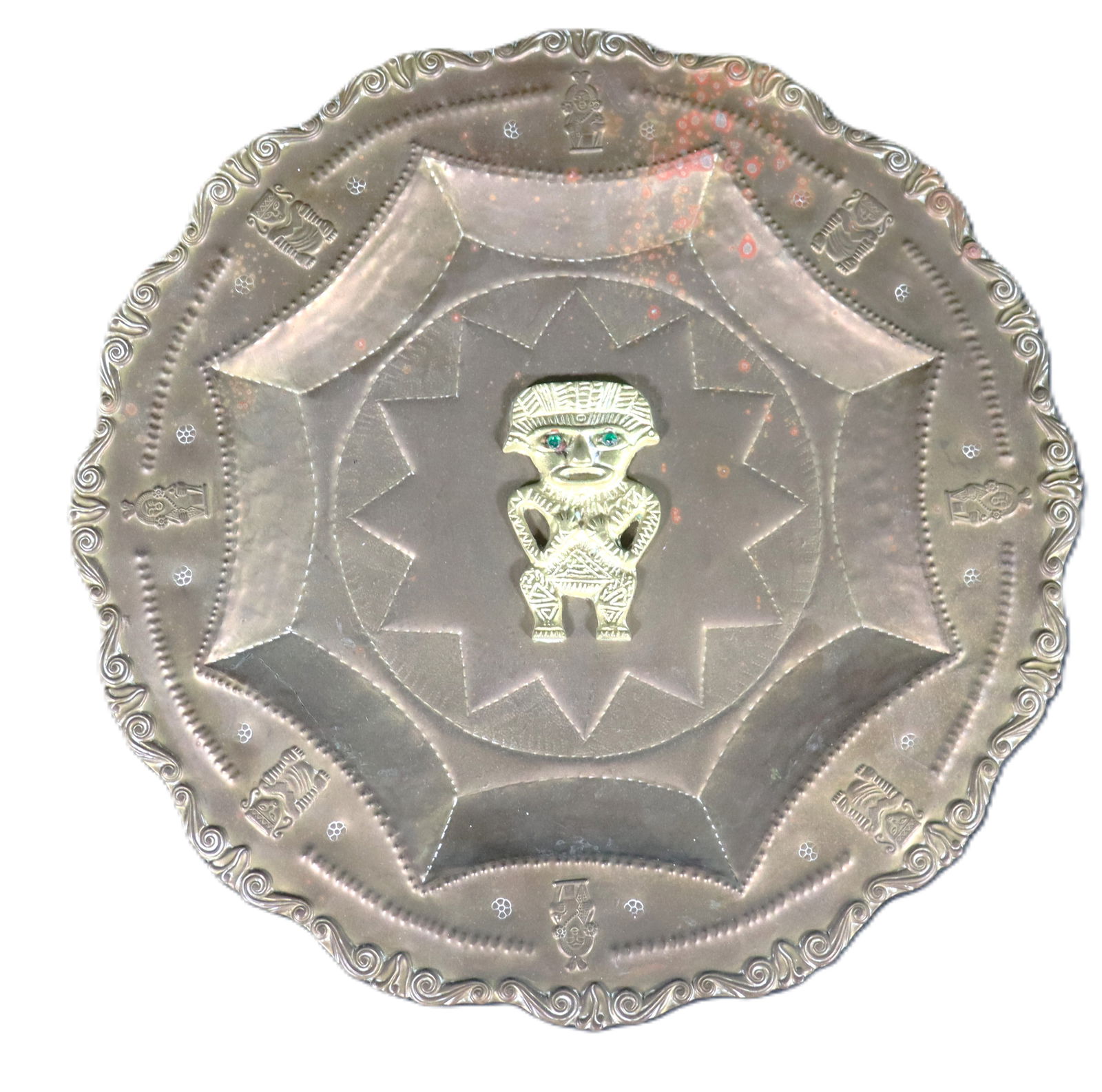 Vintage Peruvian wall plaque featuring an Incan motif.: Vintage Peruvian wall plaque featuring an Incan motif.Features a circular shape with intricate symbols surrounding a central tribal or Incan deity figureDIMENSIONS: Height 0.75 inch / 2 cm