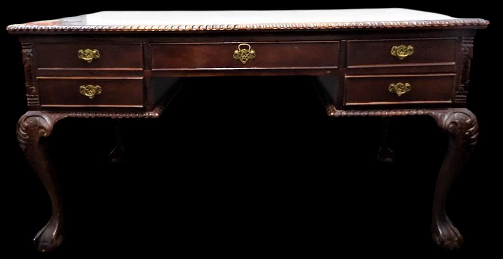 Vintage Chippendale style mahogany partner's desk, 20th c., five drawers, cabriole legs with carved: Vintage Chippendale style mahogany partner's desk, 20th c., five drawers, cabriole legs with carved knees, on ball and claw feet, DIMENSIONS: Height: 31.50 inch / 80 cm 