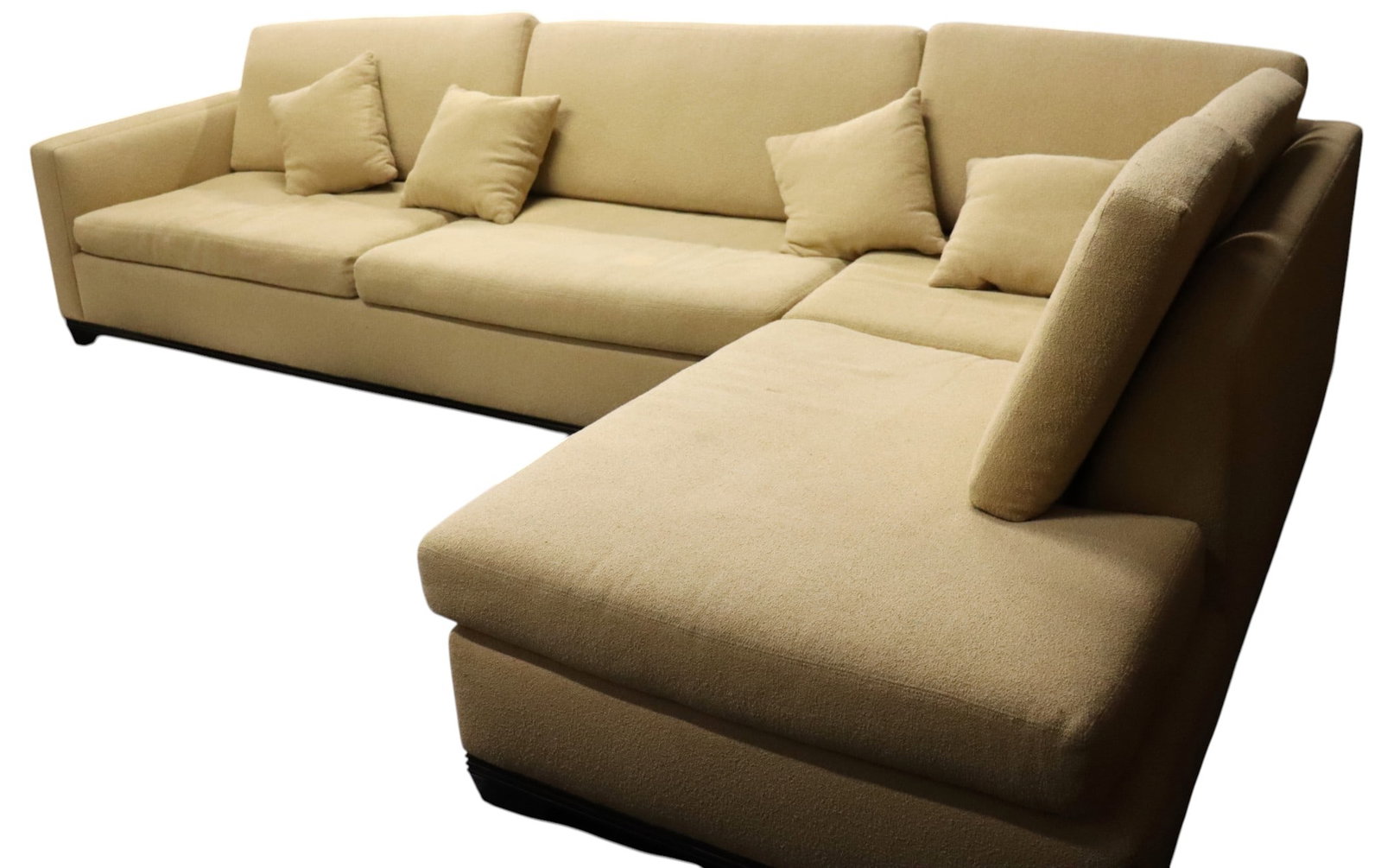 An L-shaped configuration for a beige Two-piece sectional sofa: An L-shaped configuration for a beige Two-piece sectional sofa, the upholstery is a neutral beige or cream fabric, the couch has a plush appearance with loose back and seat cushions. DIMENSIONS