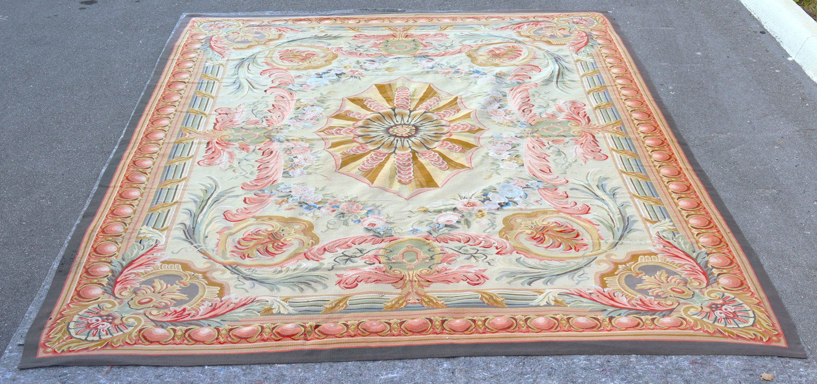 Vintage French Savonnerie rug in the Empire style, featuring a central medallion with floral and: Vintage French Savonnerie rug in the Empire style, featuring a central medallion with floral and neoclassical motifs in pastel colors. Known for their plush texture and regal, naturali