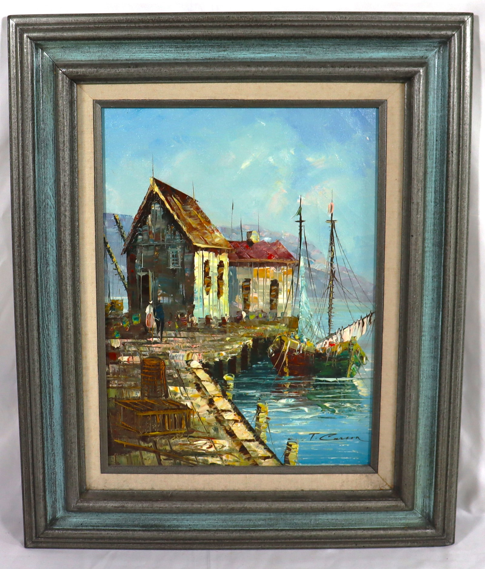 Framed oil on canvas painting signed T. Carson: Framed oil on canvas painting signed T. Carson, depicting a mid-century harbor scene with boats and shacks DIMENSIONS with frame: Height 22.75 inch / 57,8 cm &nb