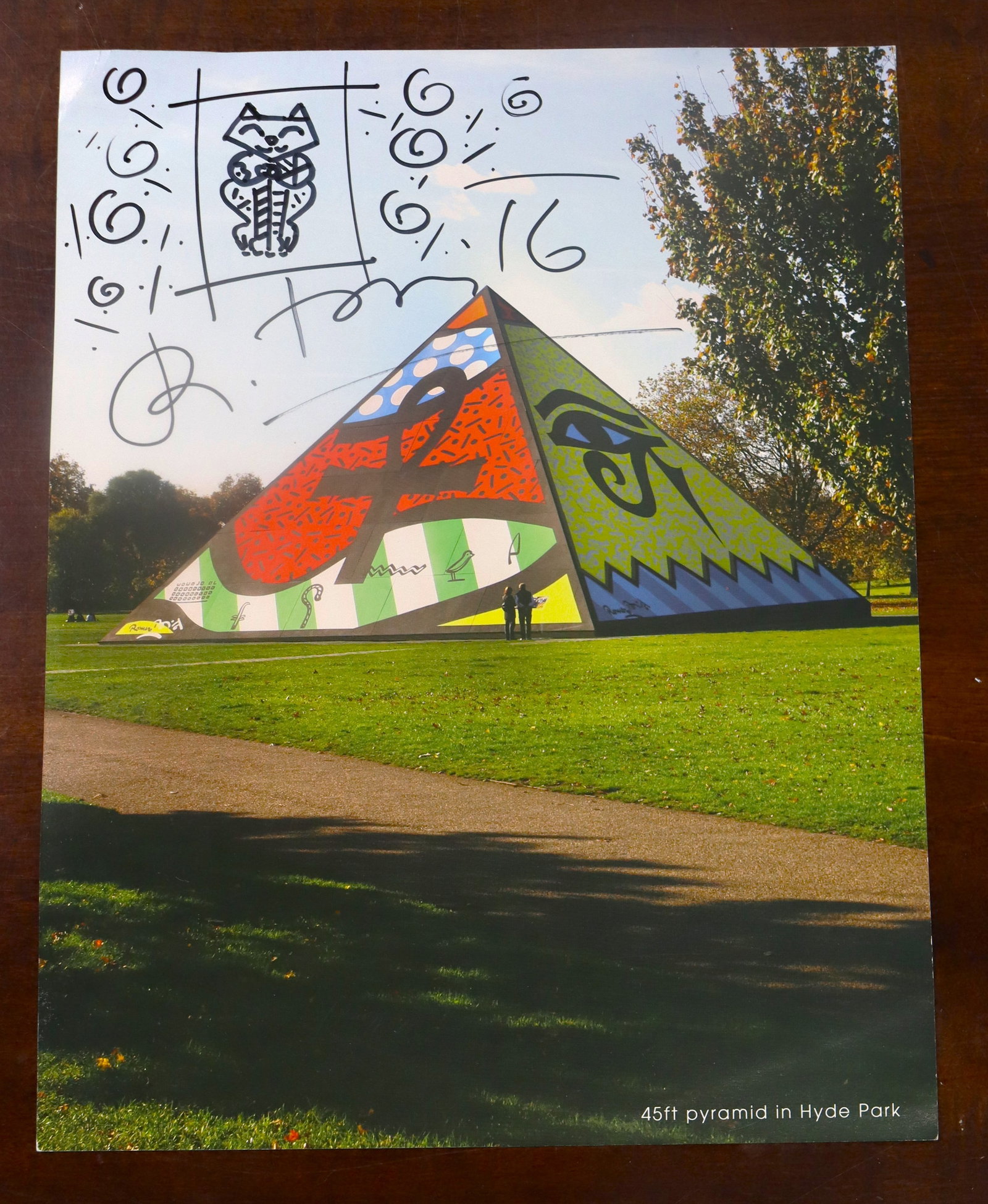 Ink on catalog Hand signed on the front and back by Romero Britto: Ink on catalog Hand signed on the front and back by Romero Britto. Romero Britto also drew on the front of the catalog. Romero Britto (Brazilian, b. 1963) This is catalog picture of a